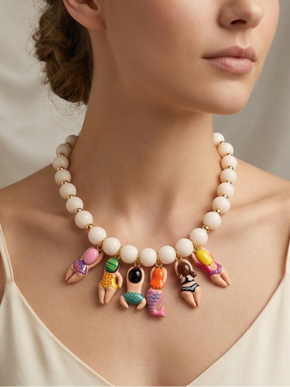 Anthropologie Cream Bead Necklace with Multicolor Swimmers Charms NWOT - Picture 2 of 8
